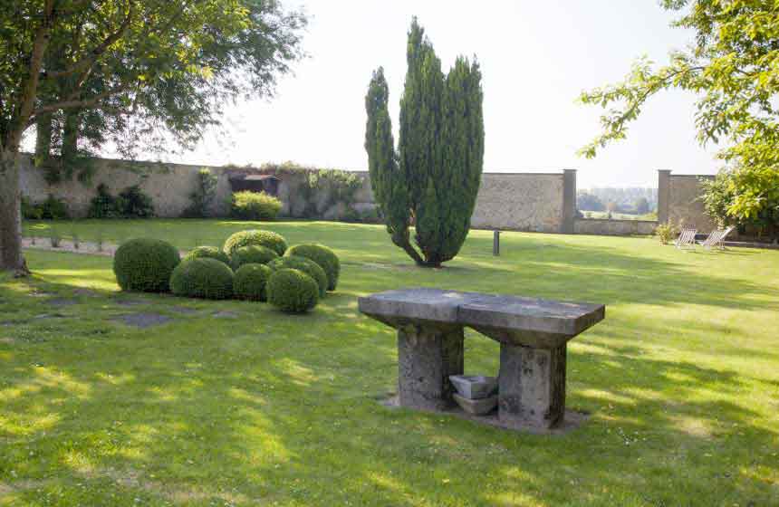 The grounds of Ferme du Vert in Northern France with beautiful rolling countryside beyond